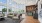 Seating and office space with floor to ceiling windows