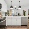 Kitchen with white cabinets and stainless steel appliances in Charlotte, NC