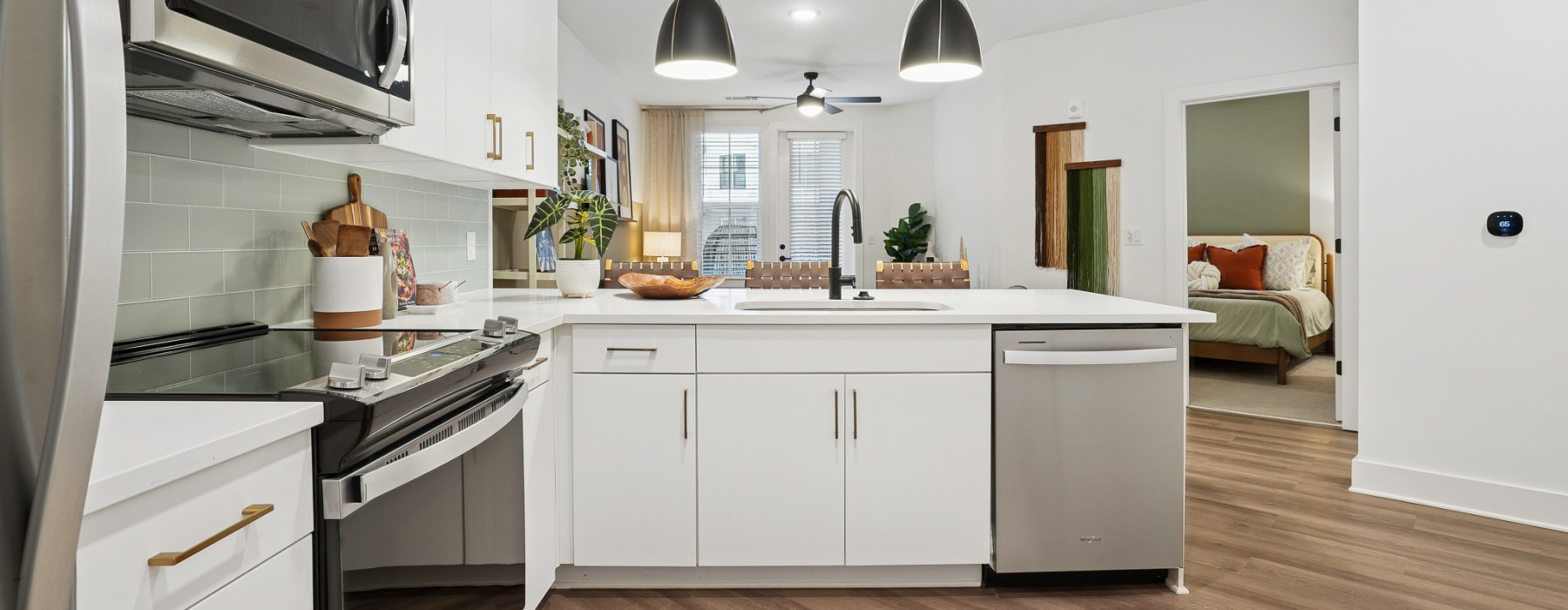 Kitchen with white cabinets and stainless steel appliances in LoSo, Charlotte, NC