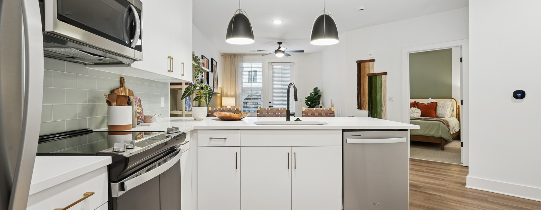 Kitchen with white cabinets and stainless steel appliances in LoSo, Charlotte, NC