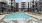Resort-style swimming pool with lounge seating